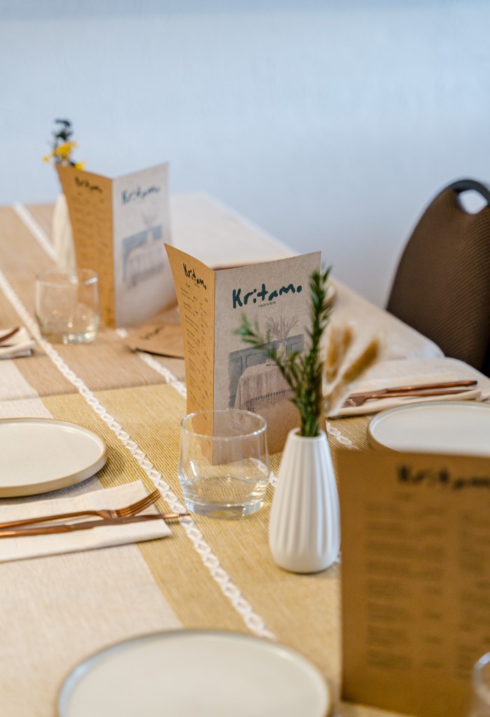 Kritamo table setting with menus and place settings